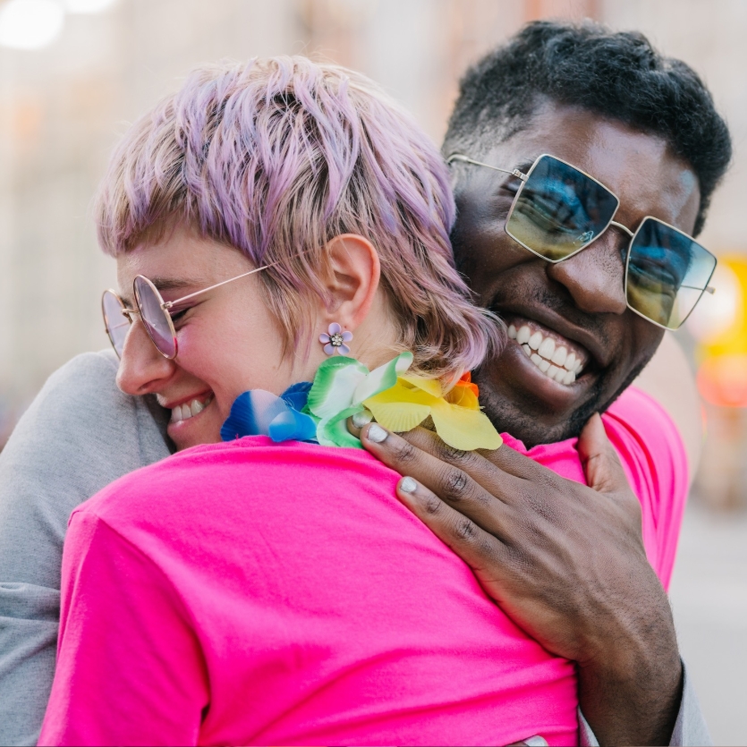 Friends smiling and embracing