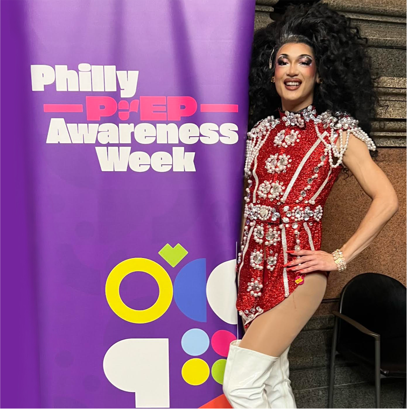 Mandy Mango next to PrEP Awareness Week Sign 2025